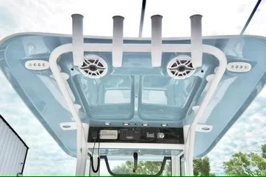 Slide: The Image of 2026 Sea Hunt Ultra 255 SE boat roof with rod holders and speakers. - 10