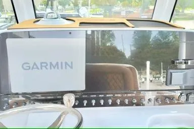 Slide: The Image of Dashboard of 2026 Sea Hunt Ultra 255 SE with Garmin navigation system. - 11