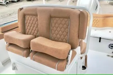 Slide: The Image of Luxurious seating on 2026 Sea Hunt Ultra 255 SE boat with tan upholstery. - 13
