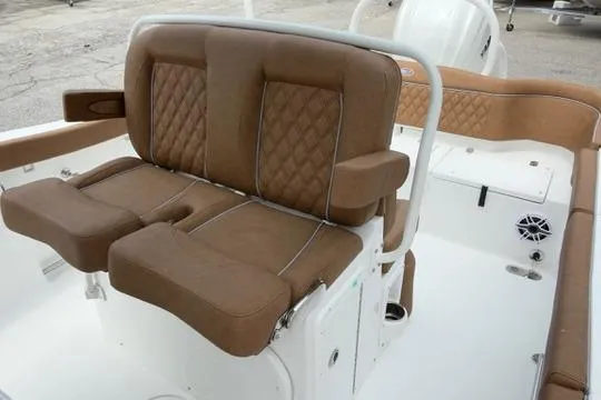Slide: The Image of Luxurious seating on 2026 Sea Hunt Ultra 255 SE boat, featuring brown leather upholstery. - 14