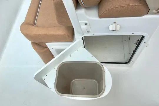 Slide: The Image of Interior of 2026 Sea Hunt Ultra 255 SE boat with storage compartment and seating. - 17