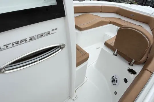 Slide: The Image of 2026 Sea Hunt Ultra 255 SE boat interior with tan seating and sleek design. - 20