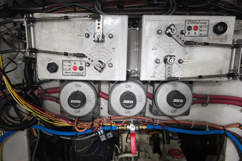 Slide: The Image of Engine control panel of a 1990 Topaz 39 Royale with wiring and switches. - 22