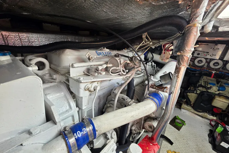 Slide: The Image of Engine room of a 1990 Topaz 39 Royale boat, showcasing detailed mechanical components. - 27