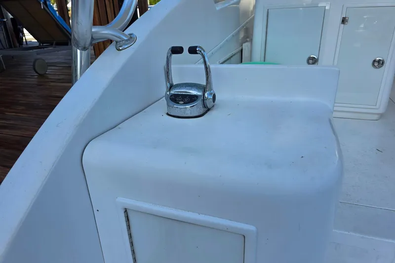 Slide: The Image of Control lever on 1990 Topaz 39 Royale boat deck, near storage compartments. - 7