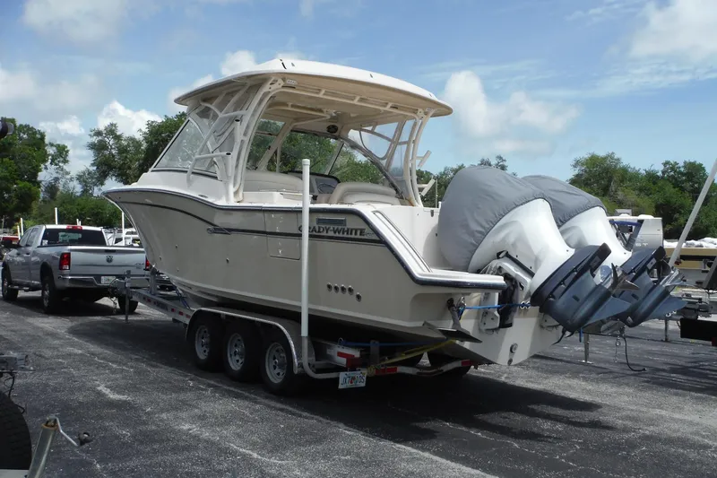 Slide: The Image of 2019 Grady-White Freedom 325 boat on trailer, parked outdoors. - 1