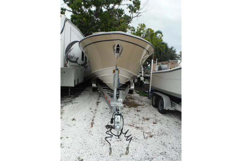 Slide: The Image of 2019 Grady-White Freedom 325 boat on trailer, parked outdoors. - 15