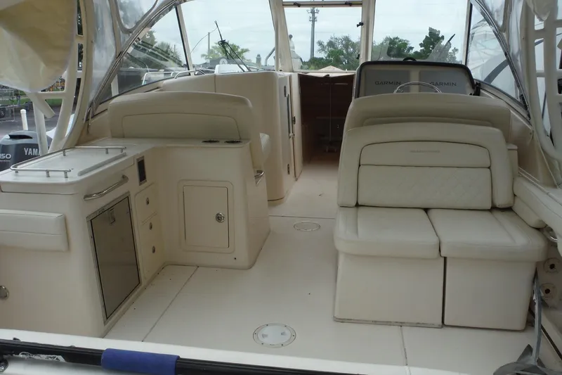 Slide: The Image of 2019 Grady-White Freedom 325 boat interior with seating and helm area. - 16