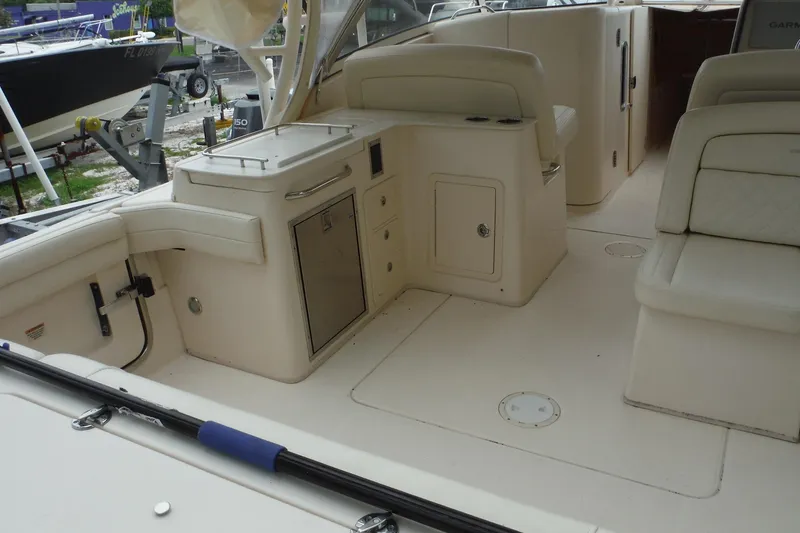 Slide: The Image of 2019 Grady-White Freedom 325 boat interior with seating and storage compartments. - 17