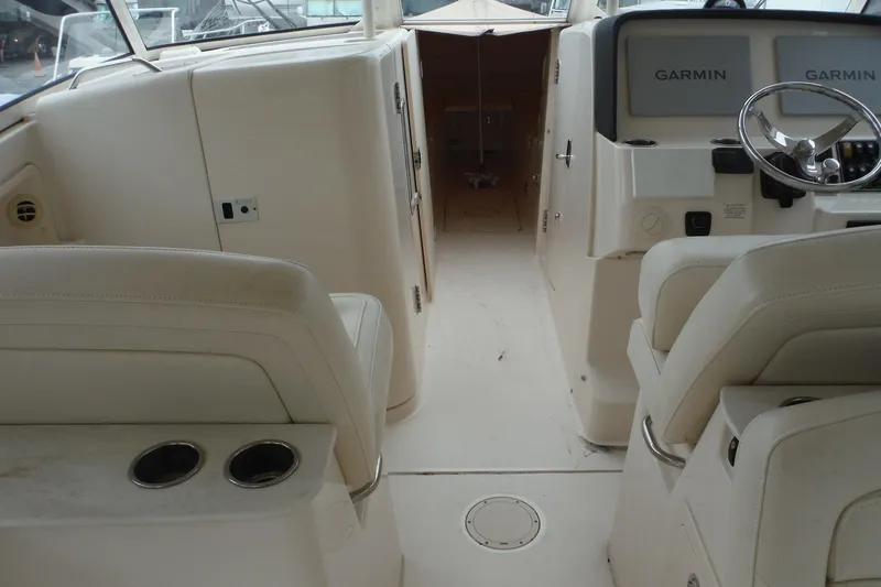 Slide: The Image of Interior view of 2019 Grady-White Freedom 325 boat with Garmin navigation system. - 19