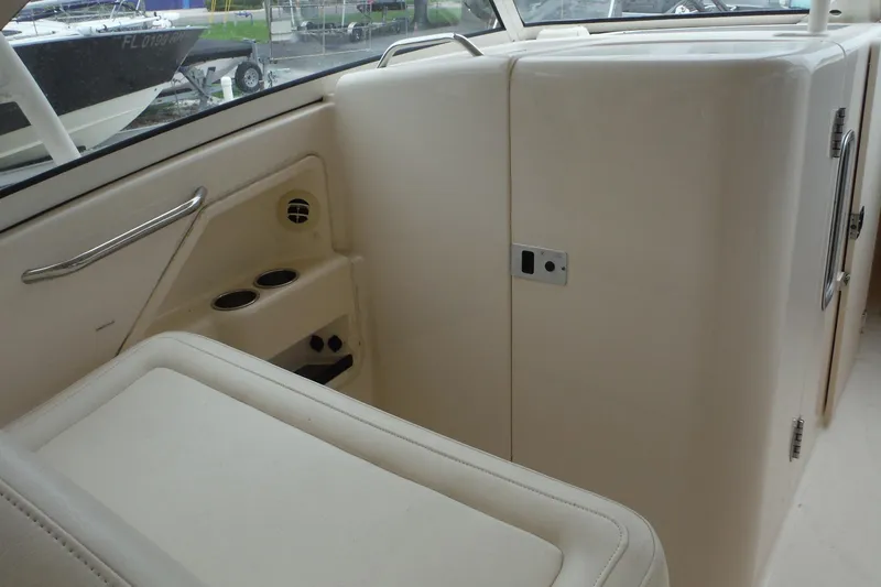 Slide: The Image of 2019 Grady-White Freedom 325 boat interior with seating and storage compartments. - 20