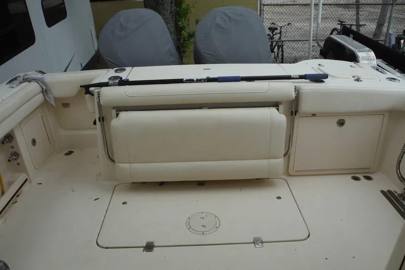 Slide: The Image of 2019 Grady-White Freedom 325 boat interior with foldable seating and storage compartments. - 26