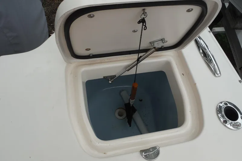 Slide: The Image of Livewell compartment on a 2019 Grady-White Freedom 325 boat, open lid view. - 28
