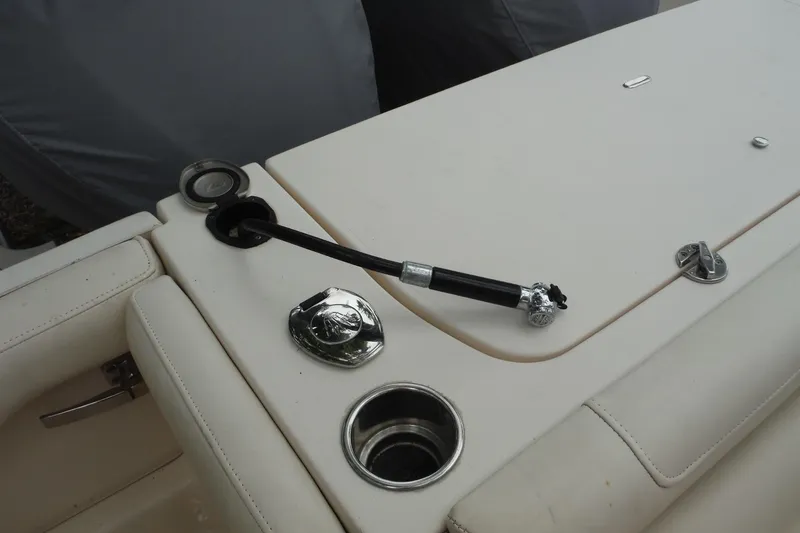 Slide: The Image of 2019 Grady-White Freedom 325 boat deck with hose and cup holder. - 29