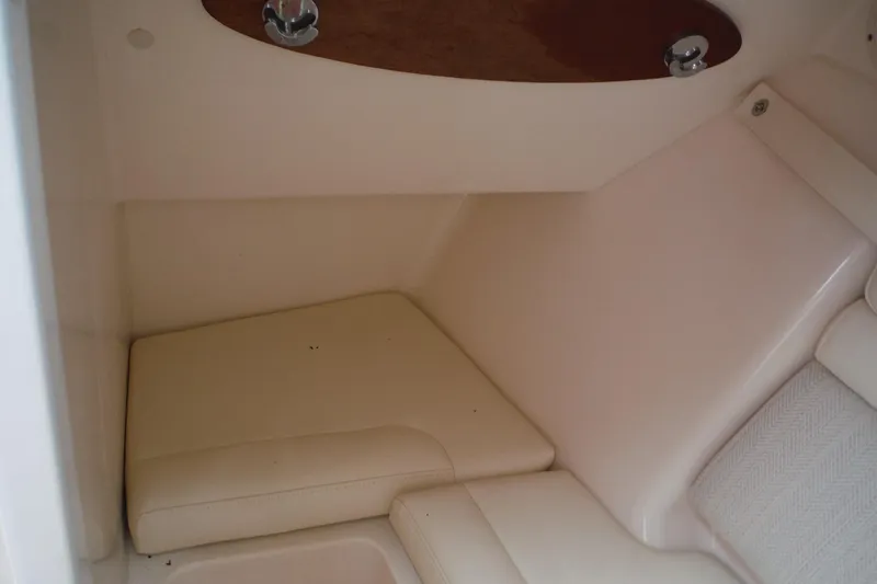 Slide: The Image of Interior cabin of 2019 Grady-White Freedom 325 boat, featuring cushioned seating. - 37