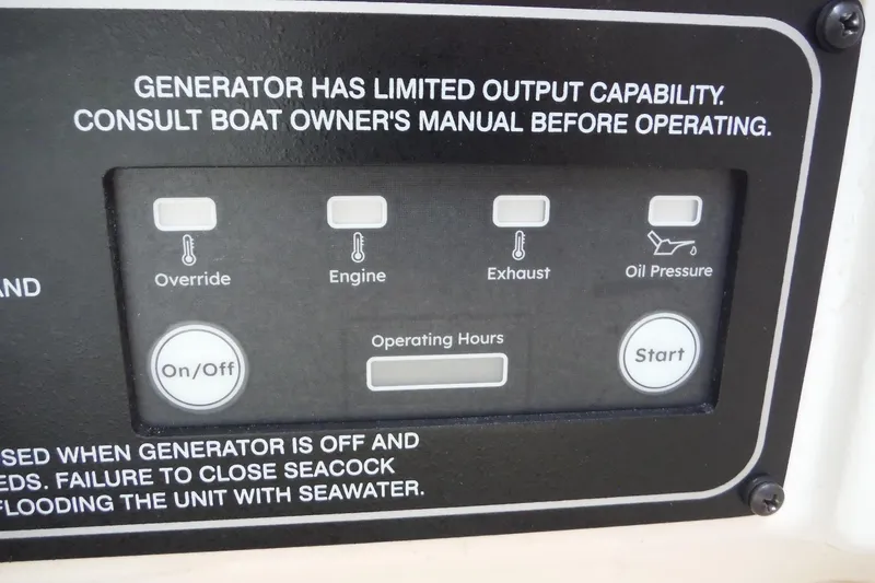 Slide: The Image of Control panel of a 2019 Grady-White Freedom 325 boat generator with operational indicators. - 41