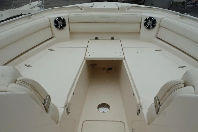 Slide: The Image of 2019 Grady-White Freedom 325 boat interior with spacious seating and built-in speakers. - 42