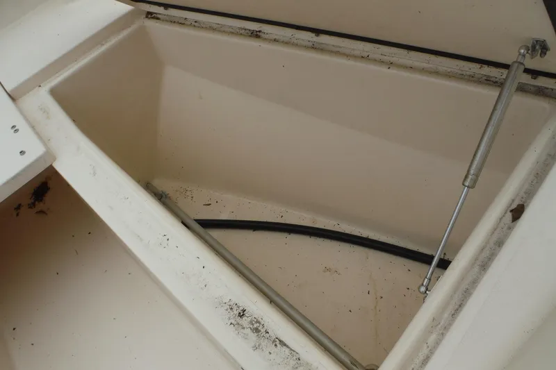 Slide: The Image of Storage compartment of a 2019 Grady-White Freedom 325 boat, showing interior details. - 43