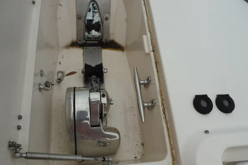 Slide: The Image of Anchor compartment of 2019 Grady-White Freedom 325 boat, featuring stainless steel fittings. - 45