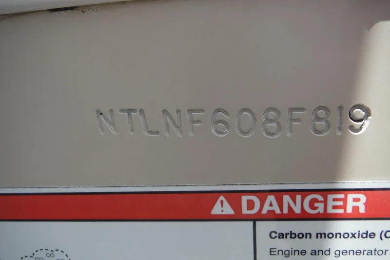 Slide: The Image of Hull identification number on 2019 Grady-White Freedom 325 boat with carbon monoxide warning. - 47