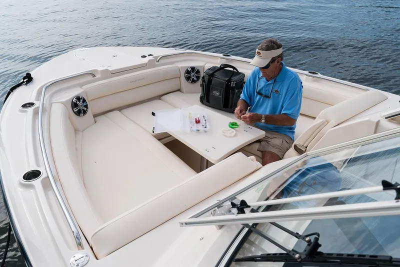 Slide: The Image of Manufacturer Provided Image: Man fishing on 2019 Grady-White Freedom 325 boat, seated in spacious bow area. - 6