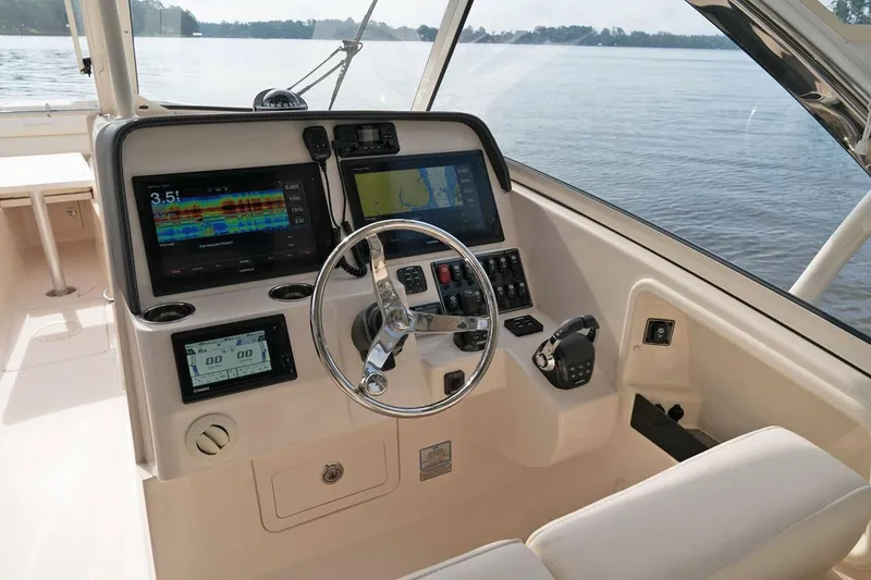 Slide: The Image of Manufacturer Provided Image: 2019 Grady-White Freedom 325 boat helm with advanced navigation systems. - 7