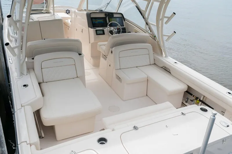 Slide: The Image of Manufacturer Provided Image: 2019 Grady-White Freedom 325 boat interior with luxurious seating and modern dashboard. - 8