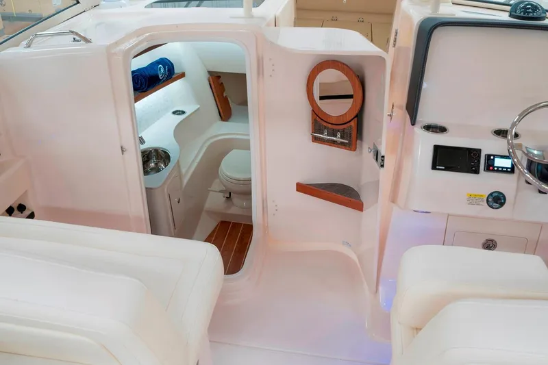Slide: The Image of Manufacturer Provided Image: 2019 Grady-White Freedom 325 boat interior with cabin and helm station. - 9