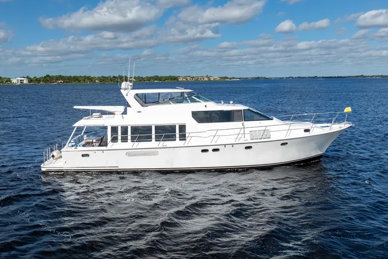 Slide: The Image of 2009 Pacific Mariner 65 Motoryacht cruising on a sunny day with blue skies. - 6