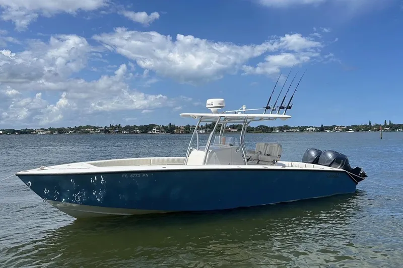 The Image of 2007 Jupiter 29 FS boat on calm water under a clear blue sky. - 0