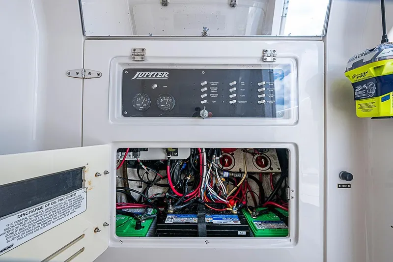 Slide: The Image of Electrical panel and battery compartment of a 2007 Jupiter 29 FS boat. - 17