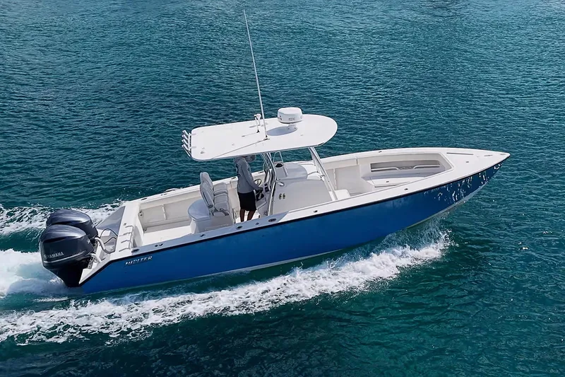 Slide: The Image of 2007 Jupiter 29 FS boat cruising on clear blue water. - 19