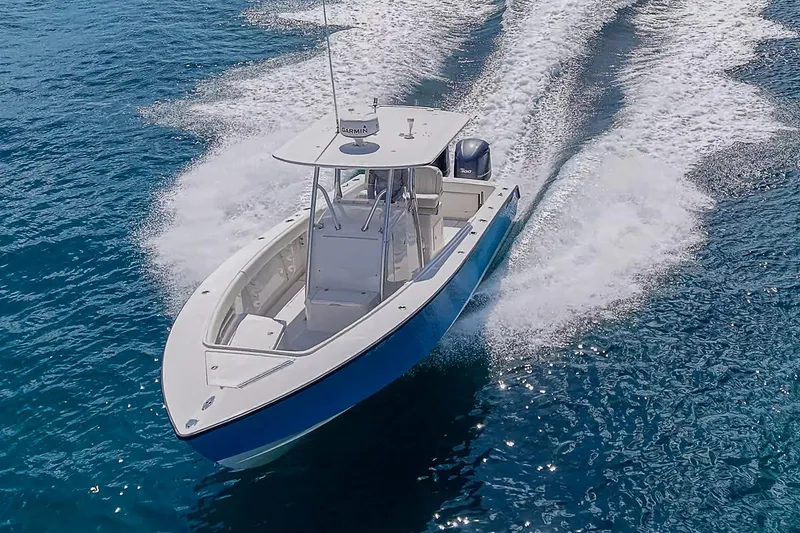 Slide: The Image of 2007 Jupiter 29 FS boat cruising on clear blue water. - 2