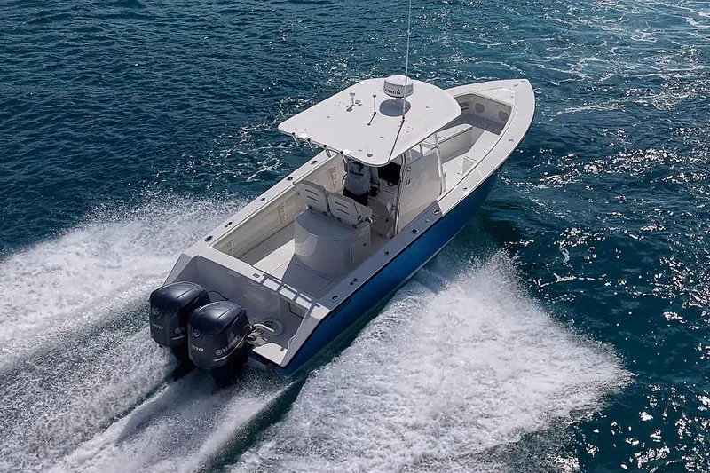 Slide: The Image of 2007 Jupiter 29 FS boat cruising on open water with twin engines. - 21