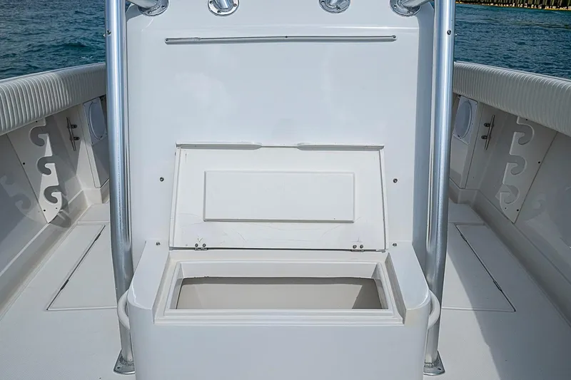 Slide: The Image of 2007 Jupiter 29 FS boat interior with open storage compartment on deck. - 5