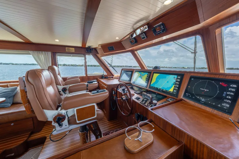 Slide: The Image of Luxurious helm of 2022 Hunt Ocean 76EP yacht with advanced navigation displays. - 11