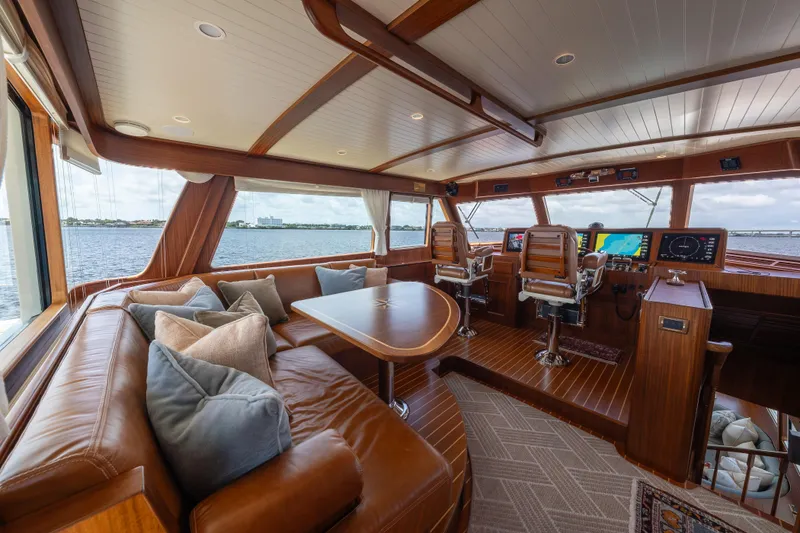 Slide: The Image of Luxurious interior of 2022 Hunt Ocean 76EP yacht with leather seating and navigation controls. - 13