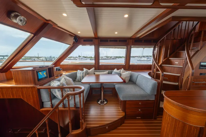 Slide: The Image of Luxurious interior of 2022 Hunt Ocean 76EP yacht with elegant wood finish and seating area. - 15