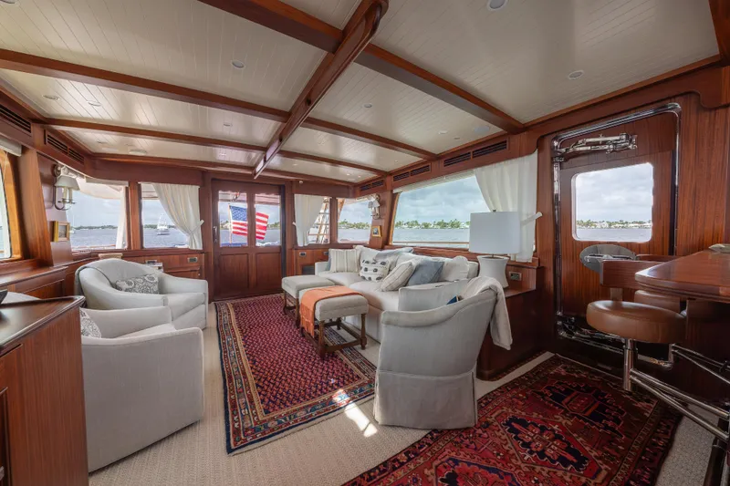 Slide: The Image of Luxurious interior of 2022 Hunt Ocean 76EP yacht with elegant seating and wooden accents. - 17