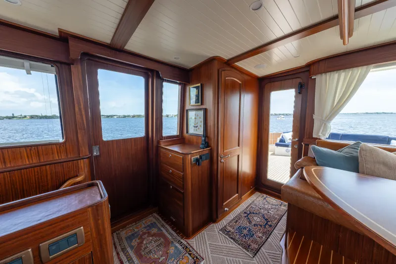 Slide: The Image of Luxurious interior of 2022 Hunt Ocean 76EP yacht with wooden finishes and ocean view. - 19