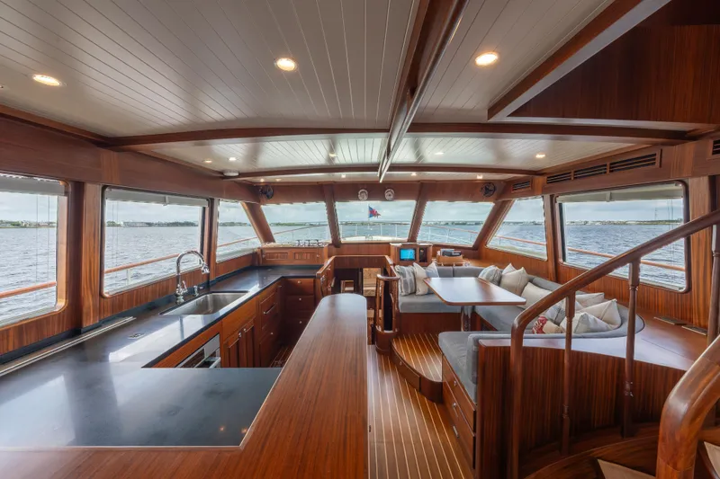 Slide: The Image of Luxurious interior of 2022 Hunt Yachts Ocean 76EP with elegant wood finishes and panoramic windows. - 29