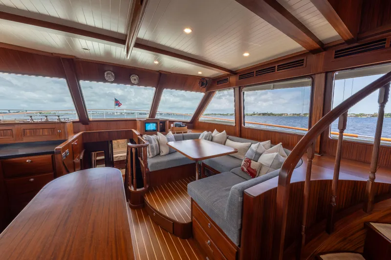 Slide: The Image of Luxurious interior of 2022 Hunt Ocean 76EP yacht with panoramic windows and elegant wood finish. - 30