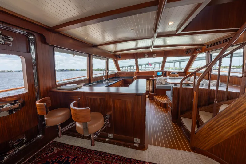 Slide: The Image of Luxurious interior of 2022 Hunt Ocean 76EP yacht with elegant wood finishes and panoramic windows. - 32