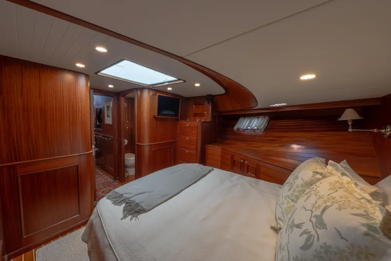 Slide: The Image of Luxurious cabin interior of 2022 Hunt Yachts Ocean 76EP with elegant wood finish. - 35