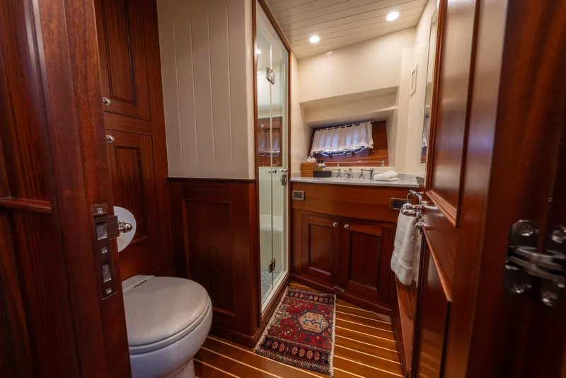 Slide: The Image of Luxurious bathroom in 2022 Hunt Ocean 76EP yacht with wooden cabinetry and modern fixtures. - 36