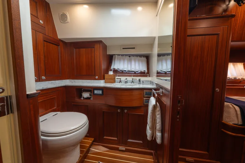 Slide: The Image of Luxurious bathroom interior of 2022 Hunt Yachts Ocean 76EP with wooden cabinetry and modern fixtures. - 37