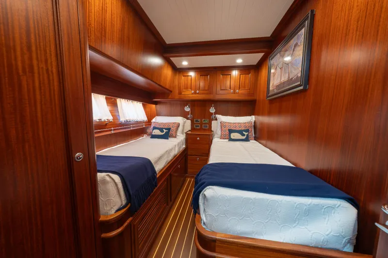 Slide: The Image of Luxurious twin cabin in 2022 Hunt Ocean 76EP yacht with elegant wood paneling. - 38