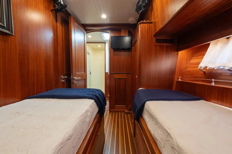 Slide: The Image of Luxurious twin cabin interior of 2022 Hunt Ocean 76EP yacht with wooden finish. - 39