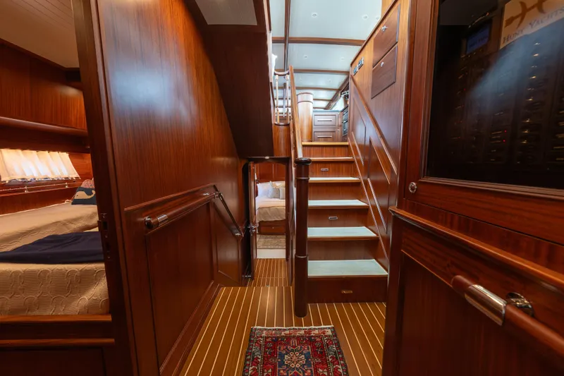Slide: The Image of Luxurious interior of 2022 Hunt Yachts Ocean 76EP, featuring elegant wood finishes and cozy cabin. - 40