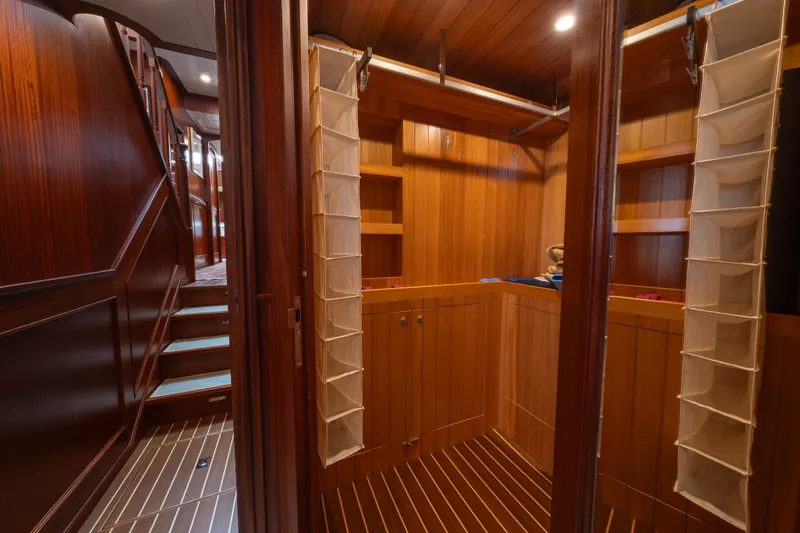 Slide: The Image of Luxurious wooden interior of 2022 Hunt Yachts Ocean 76EP, featuring elegant storage and staircase. - 41